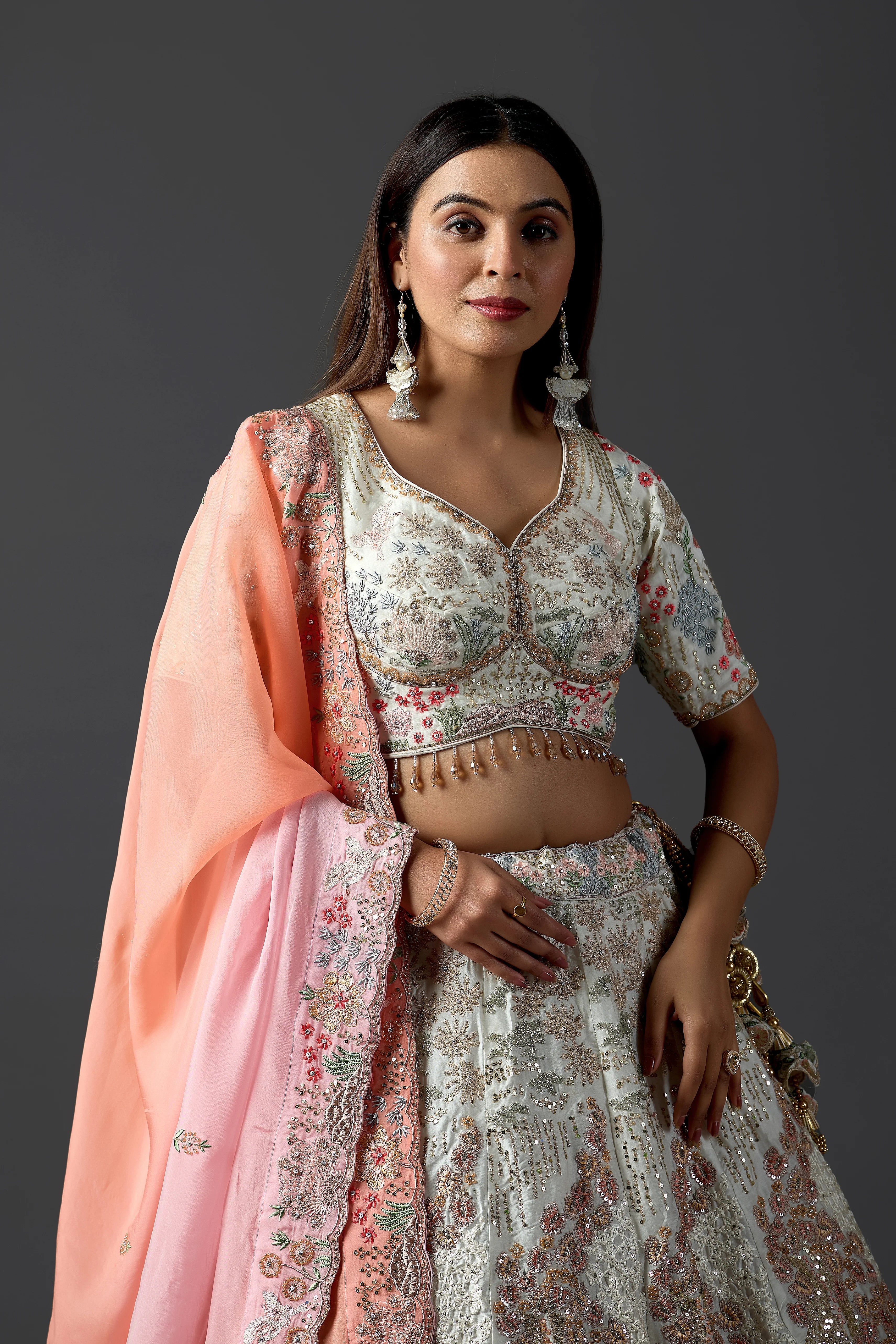 Ivory Raw Silk Applique Lehenga Choli with Multi-Color Threadwork & Sequins