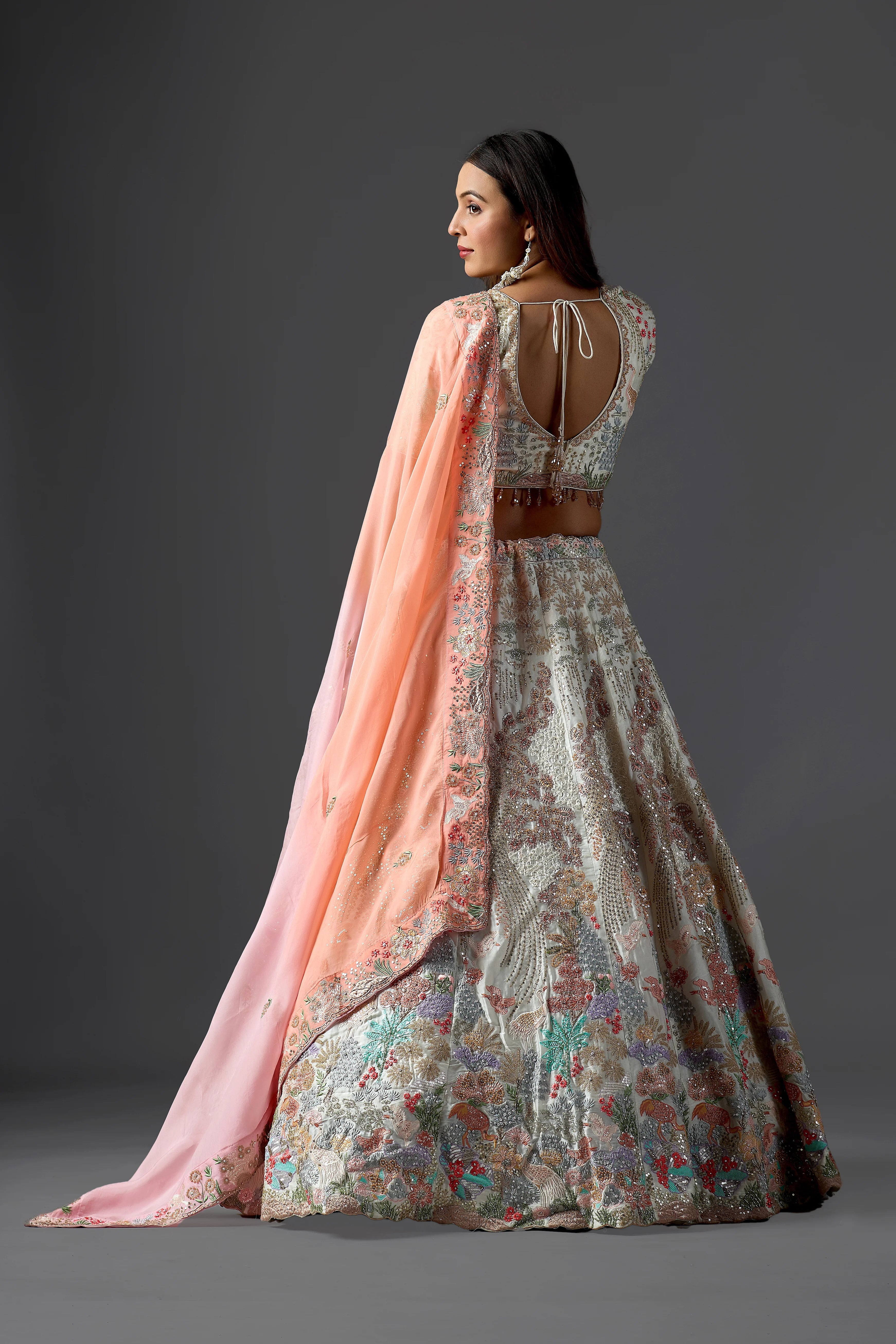 Ivory Raw Silk Applique Lehenga Choli with Multi-Color Threadwork & Sequins