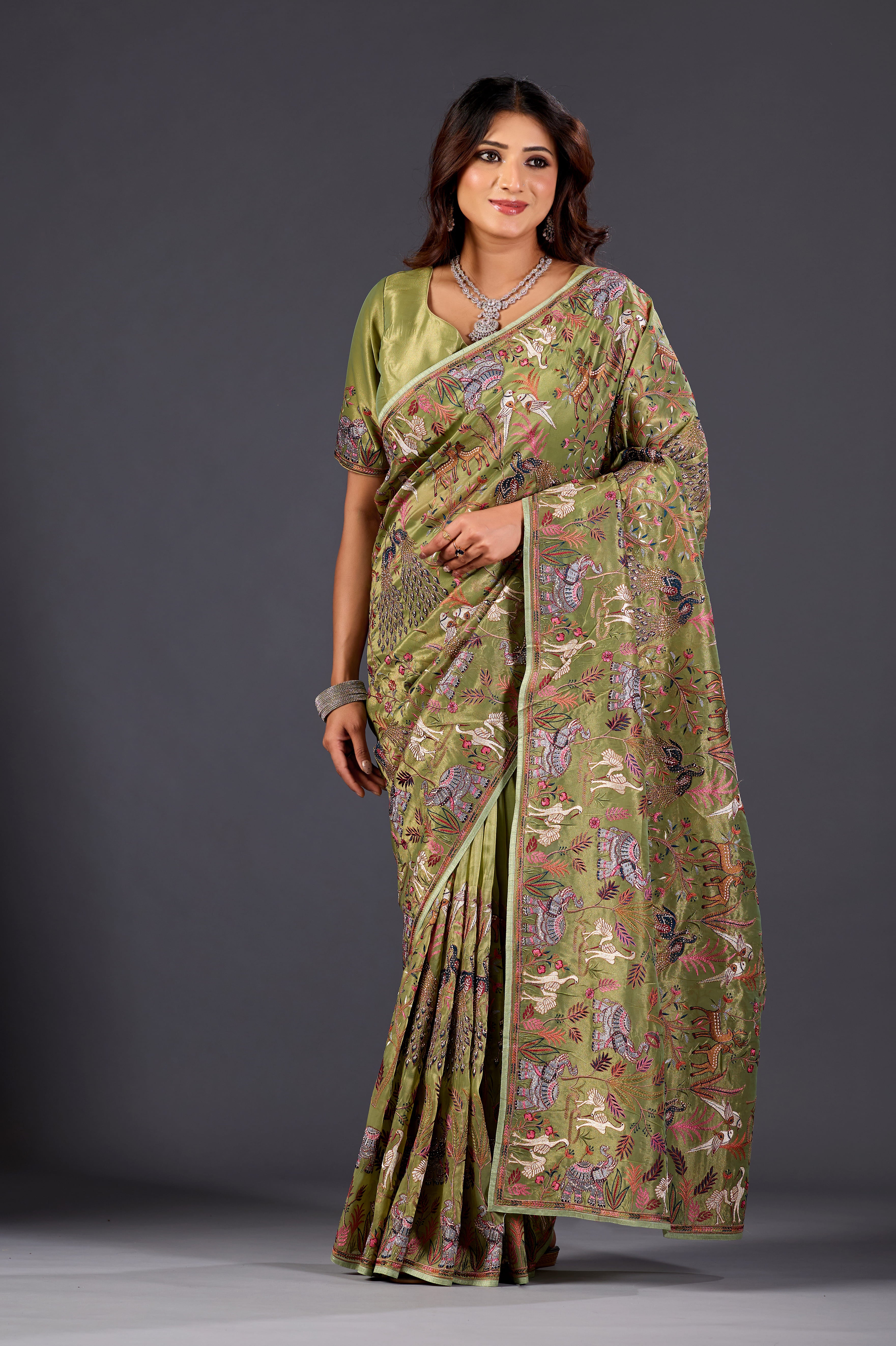 Mehandi Green  Giraffe Woven Saree With Nature Motif Embrodiery