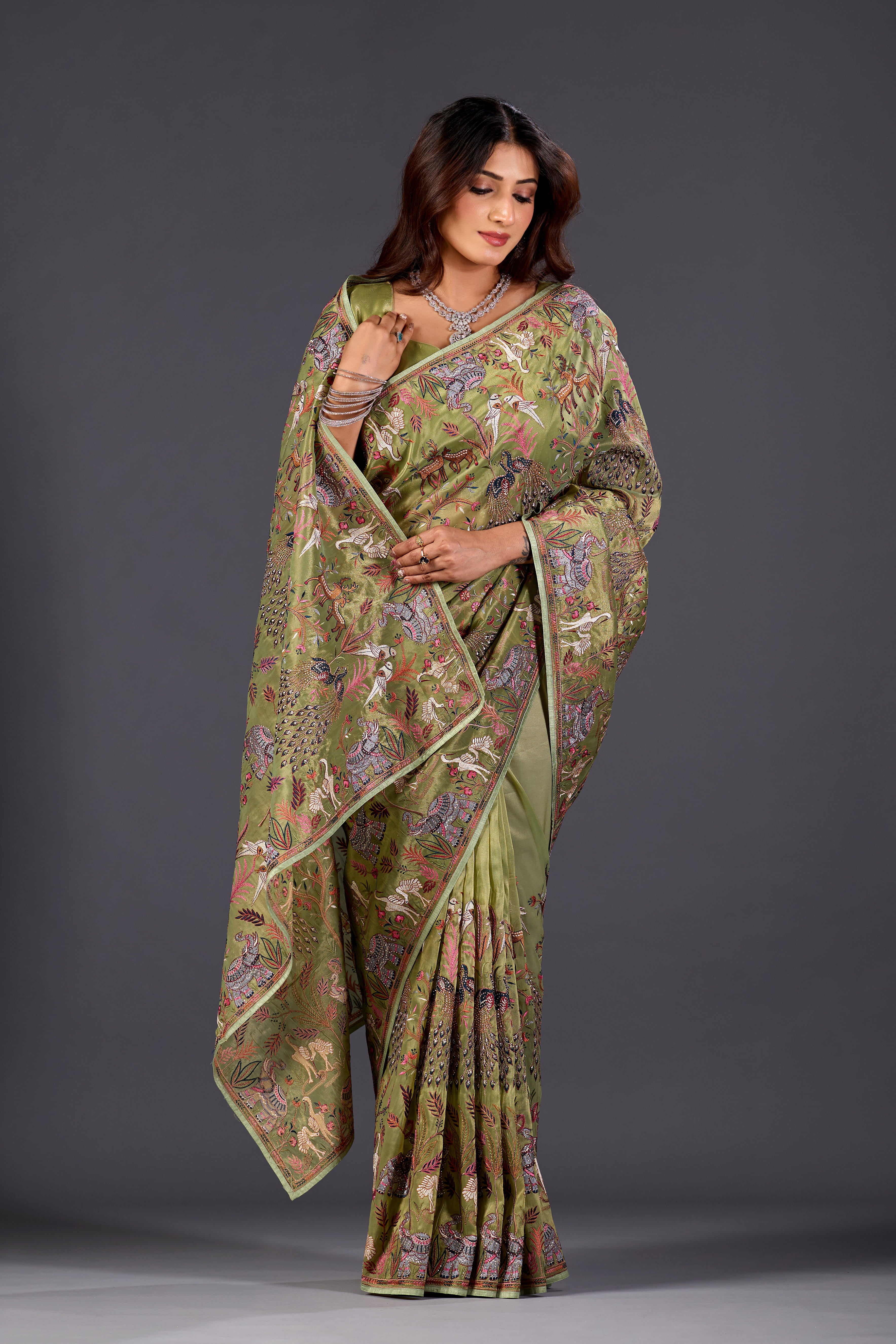 Mehandi Green  Giraffe Woven Saree With Nature Motif Embrodiery