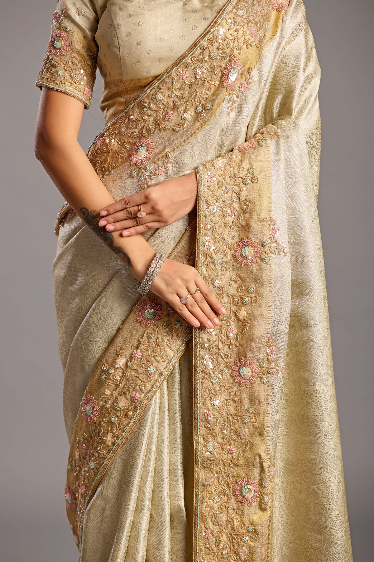 Elegant Vanilla Cream Tissue Silk Saree with Embellished Floral Border