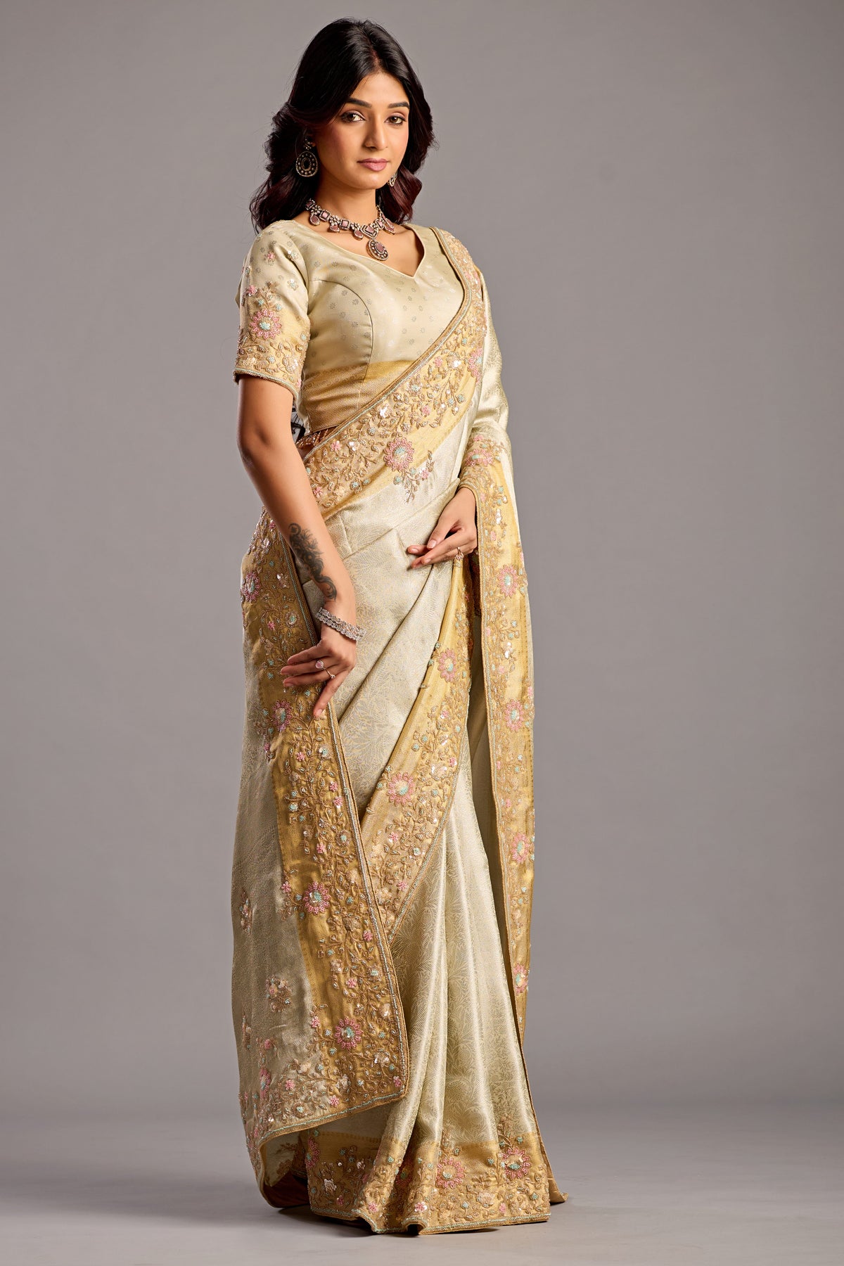 Elegant Vanilla Cream Tissue Silk Saree with Embellished Floral Border